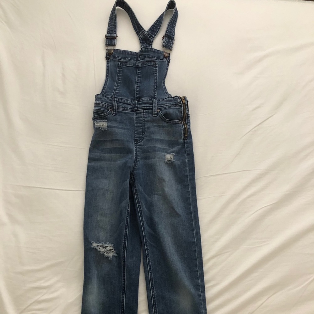 Celebrity pink distressed overalls